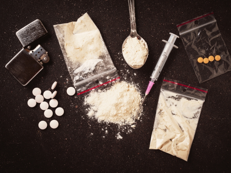 Hard drugs on dark table