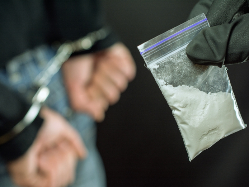 Police arrest drug trafficker with handcuffs