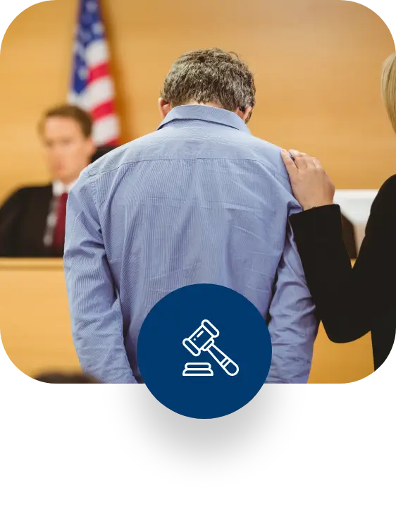 man bowing his head while hearing his sentence