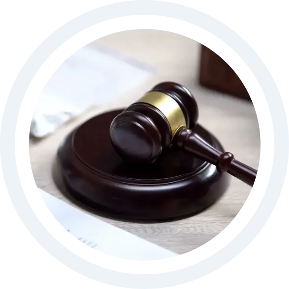 Plastic packet on table, gavel lying on sound block, drug trafficking control