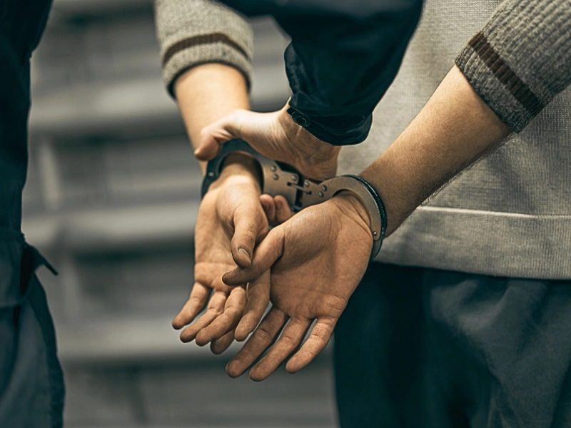 Man in handcuffs.