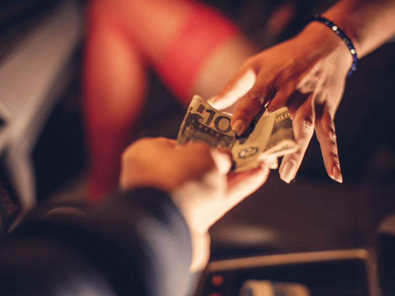 Man giving money to a prostitute
