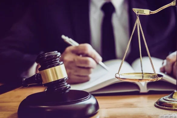 A professional setting with a male lawyer or judge working at a desk.